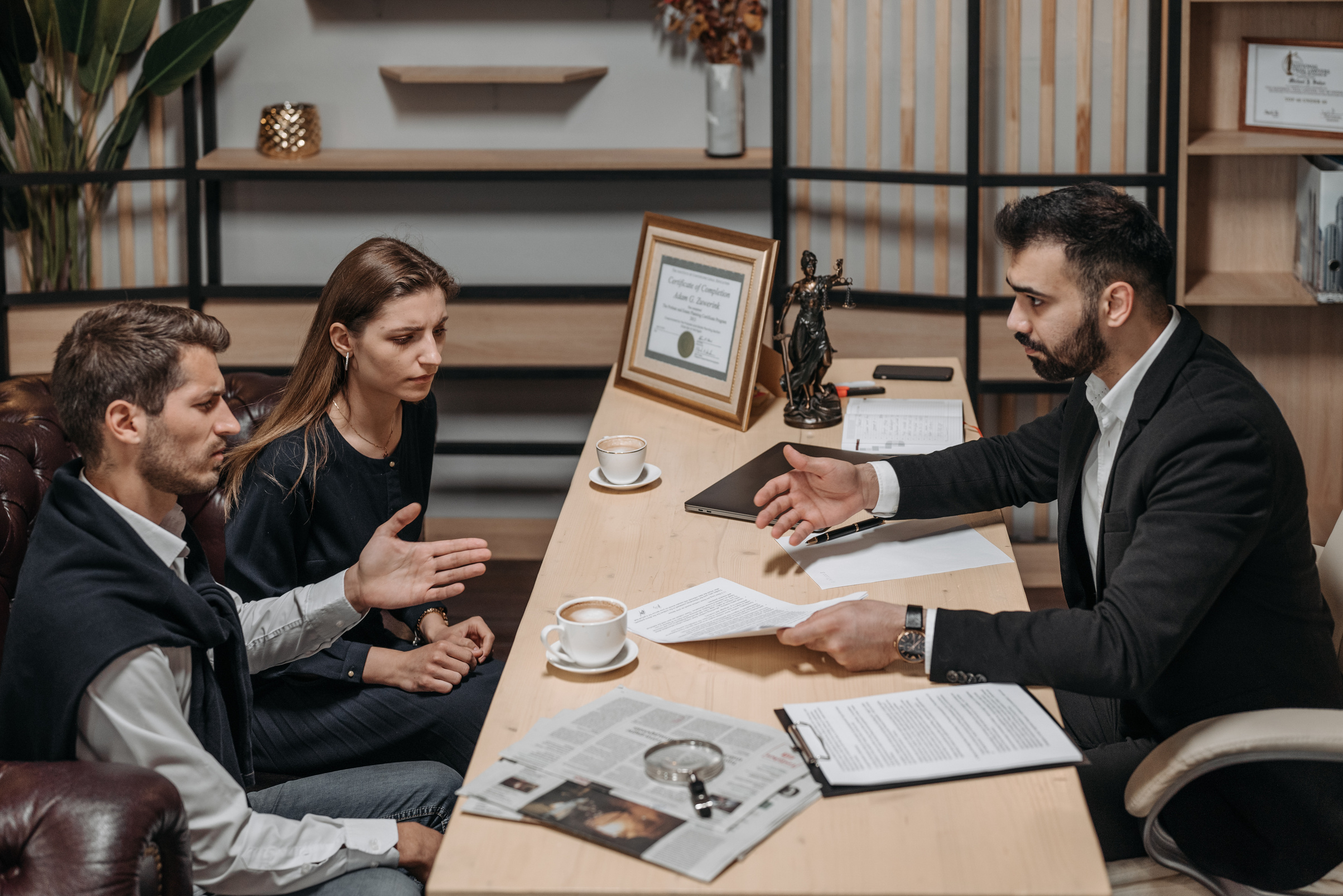 Male Lawyer talking to his Clients 